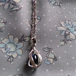 Tear drop style silver necklace, on a delicate twist chain.